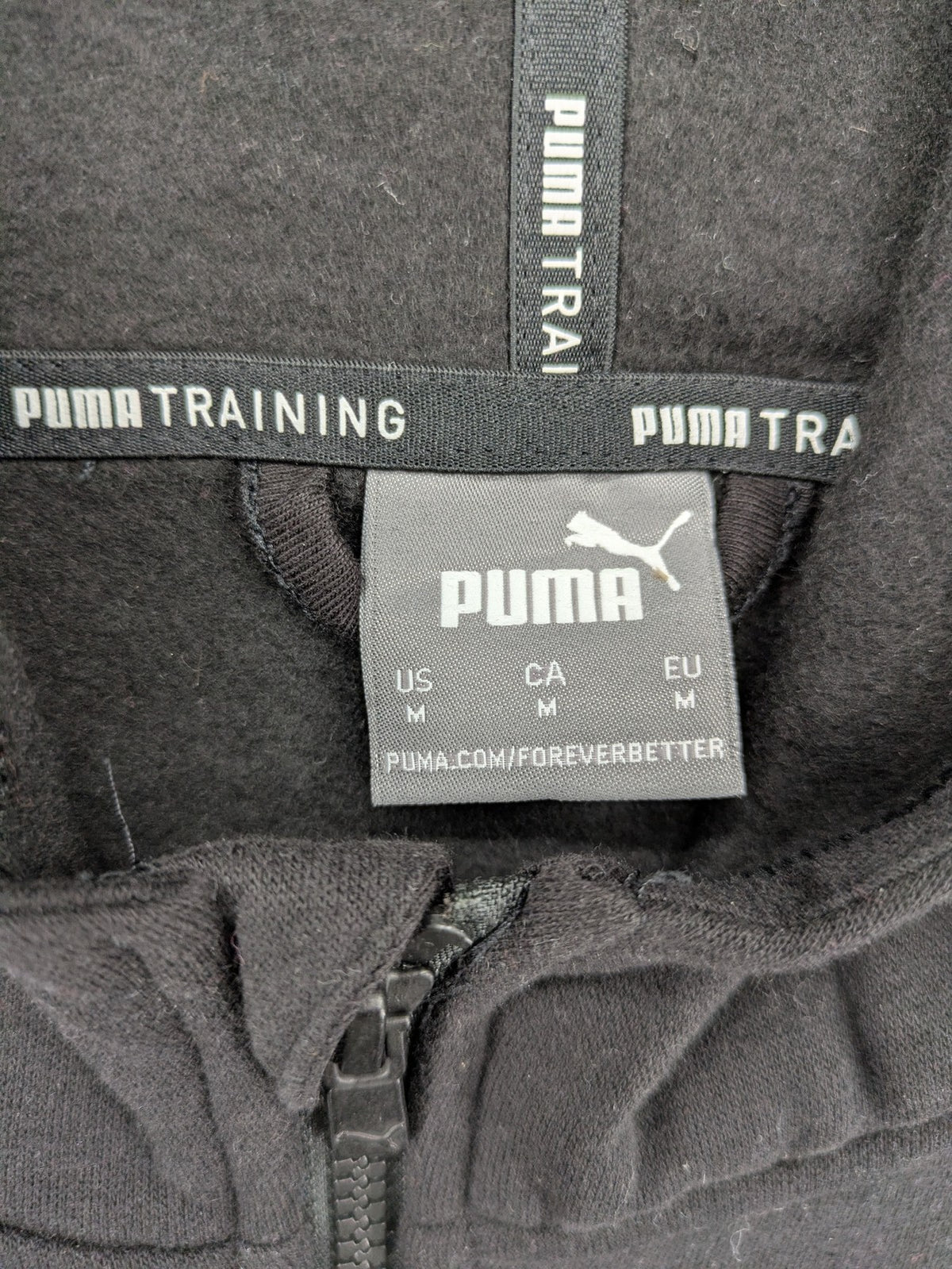 Puma grey zip-through hoodie with iconic logo and two practical pockets.
