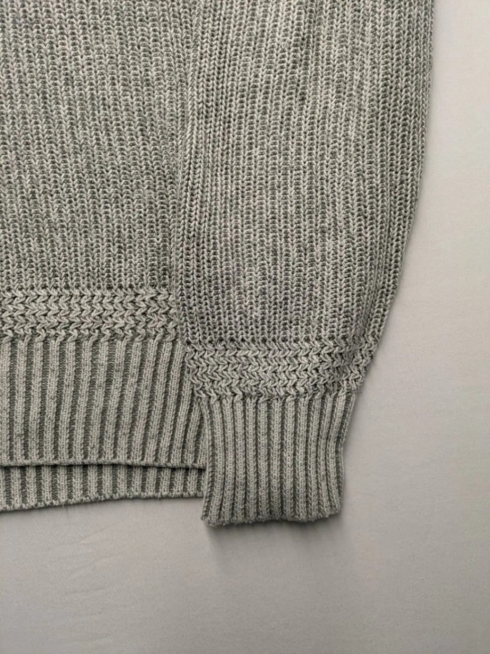 Autumn Glow grey turtle neck jumper with ribbed pattern and button detail.