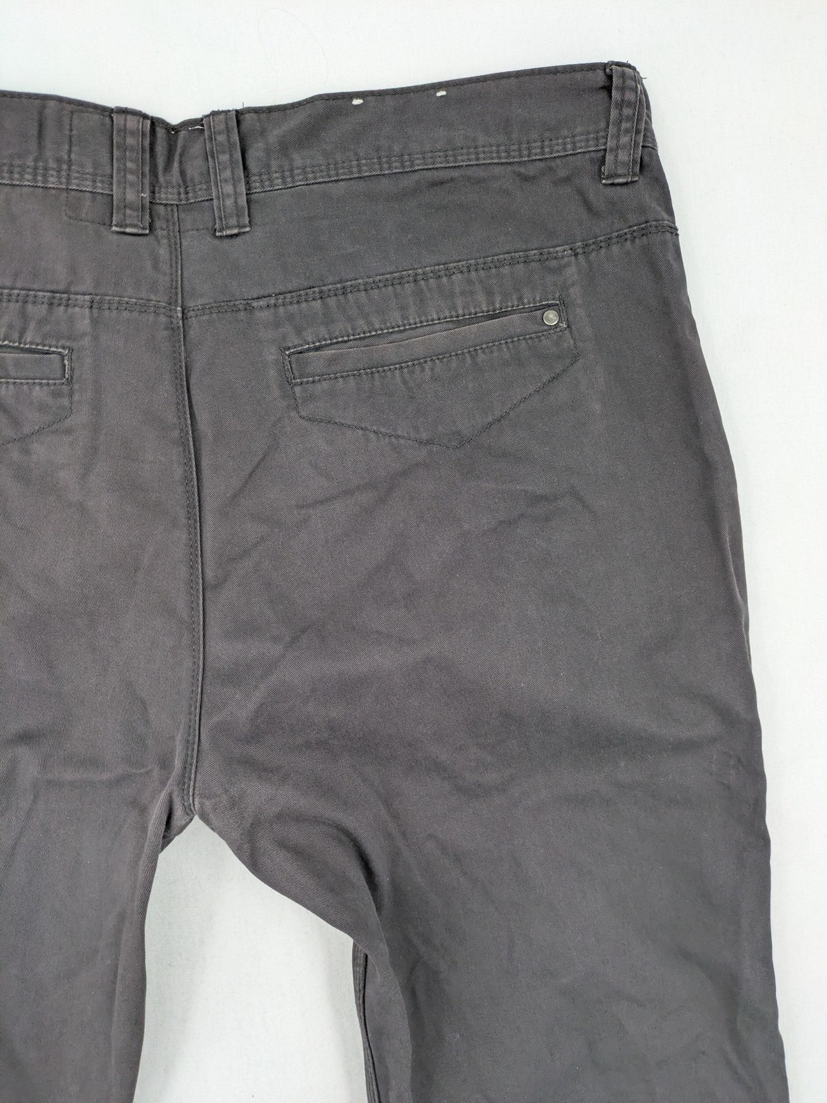 Denim & Co. grey chino pants cotton workwear with button fly and pocket rivets.