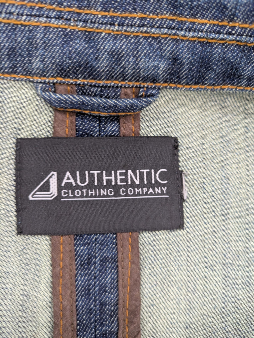 Authentic Clothing Company blue jeans blazer with contrast stitching and button closure.