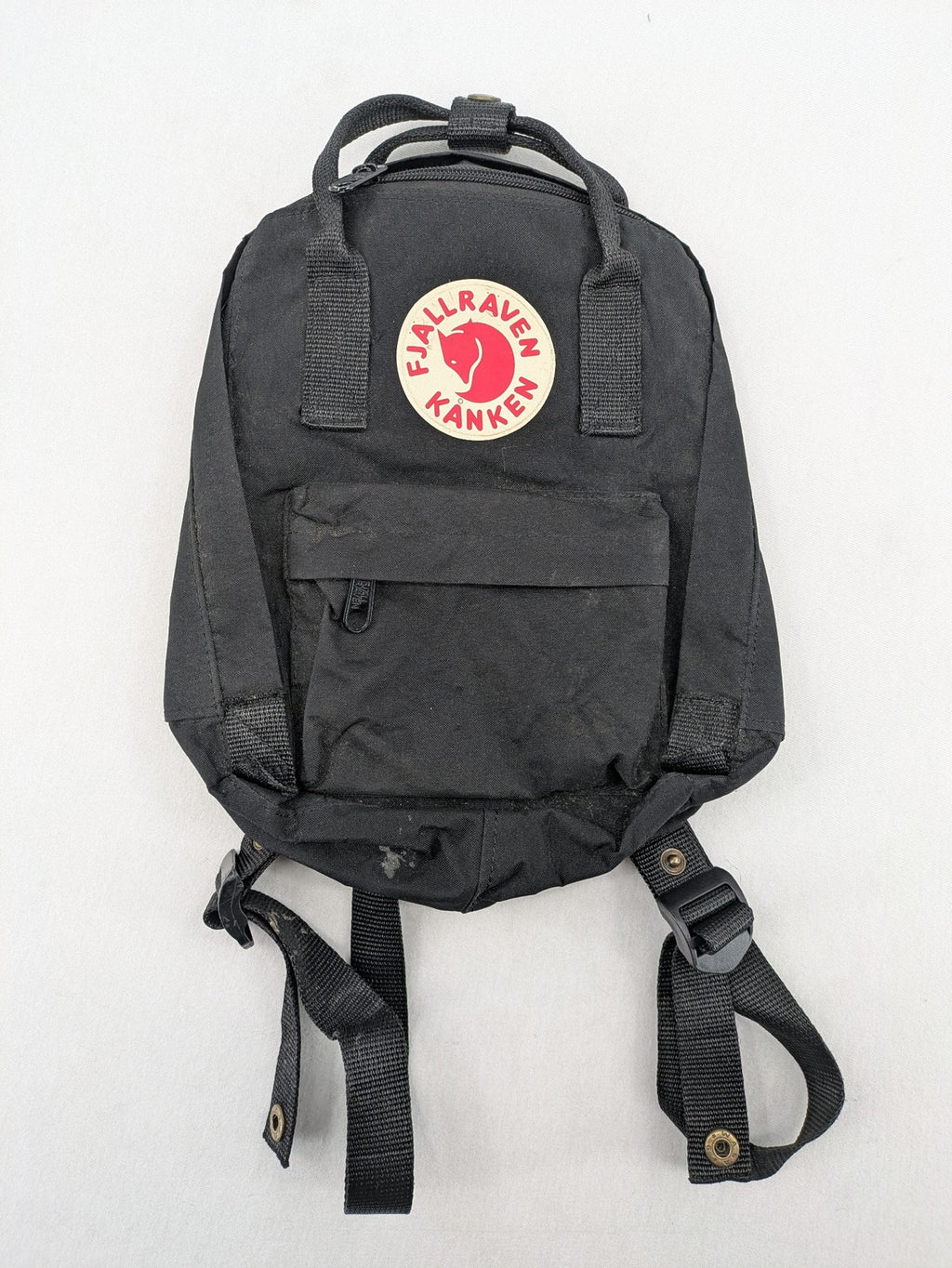 Fjällräven Kånken Mini rucksack black durable fabric with logo and zippered main compartment.