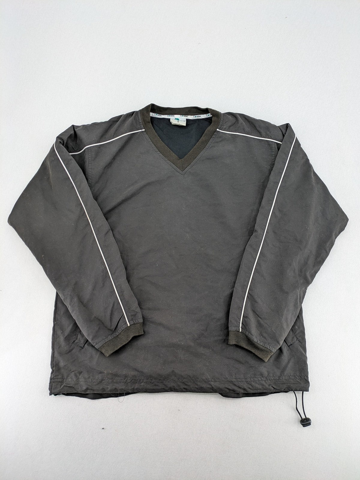 Tombo green windbreaker jacket with white piping, V-neck, and zippered pockets.