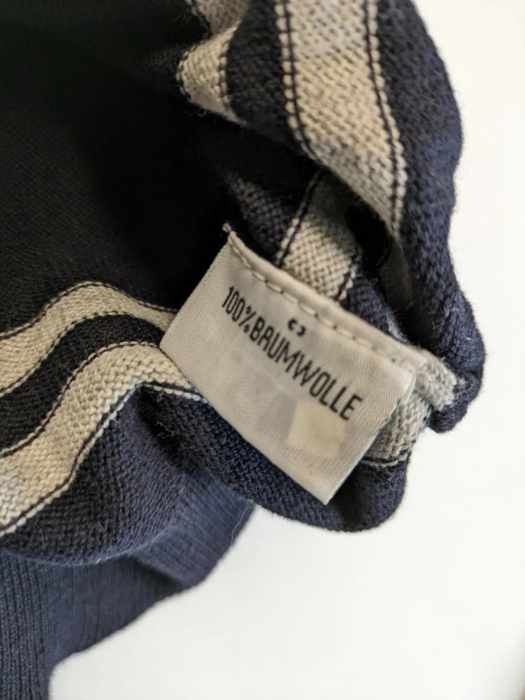 dunmore turtle neck jumper dark blue with striped trims and embroidered crest logo