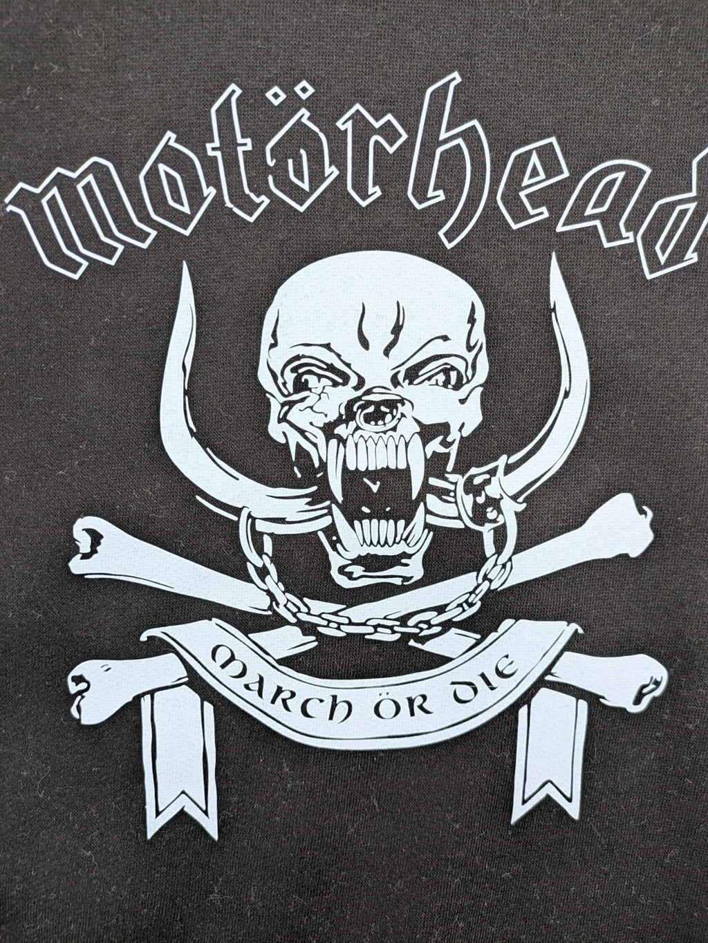 Starworld black turtle neck jumper featuring Motörhead War-Pig logo and "March ör Die" text.