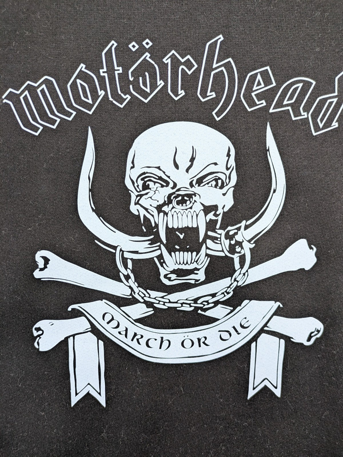 Starworld black turtle neck jumper featuring Motörhead War-Pig logo and "March ör Die" text.