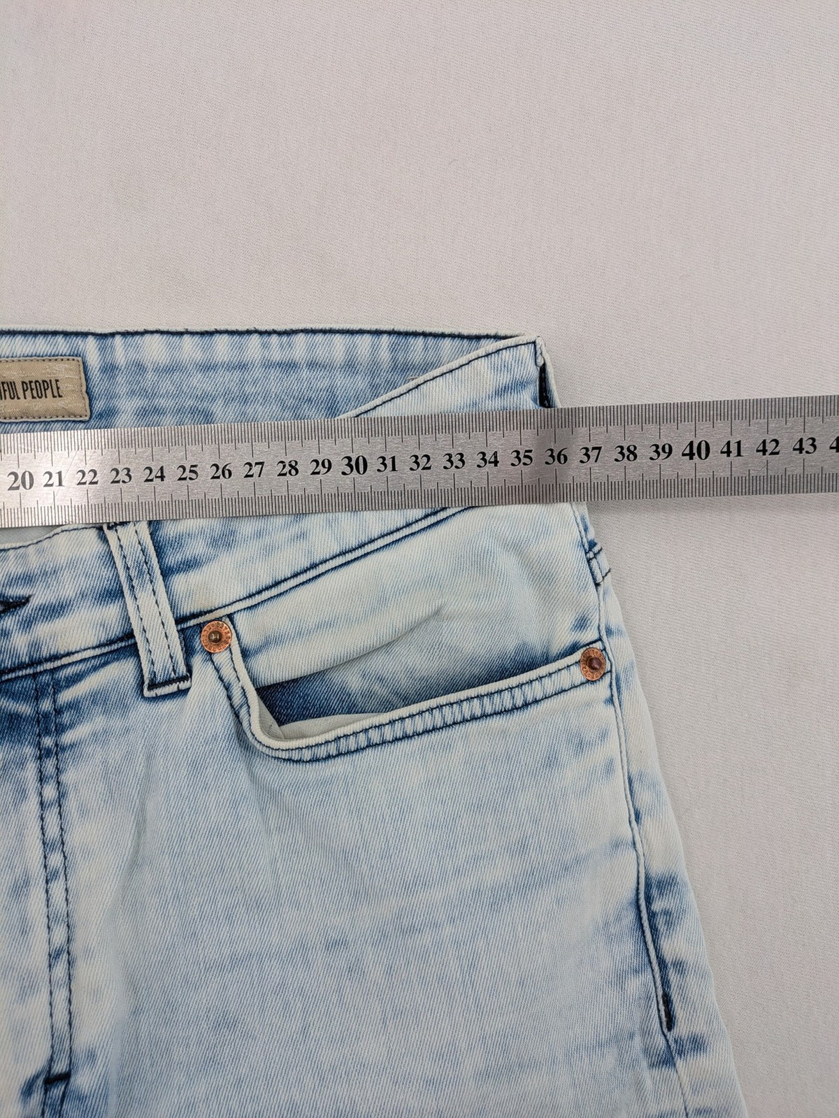 Drykorn blue slim fit jeans with acid wash and leather logo patch.