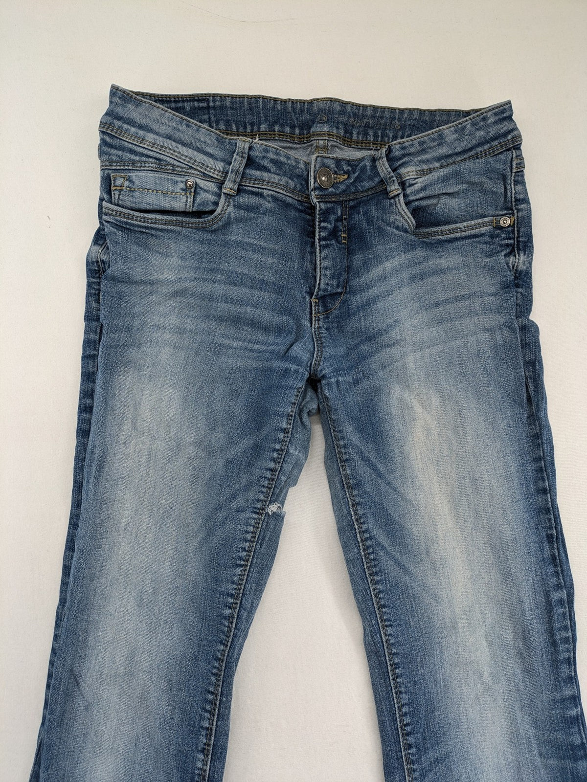 C&A blue bootcut jeans with faded denim and low rise fit, made from cotton blend.