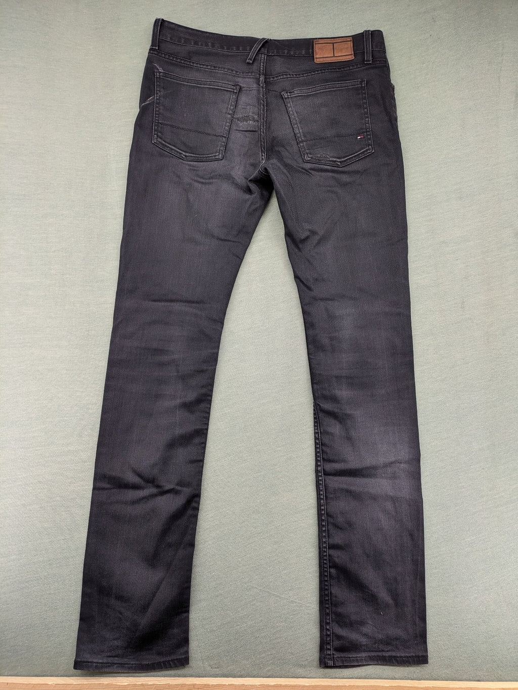 Tommy Hilfiger grey straight jeans faded denim with iconic logo detail.