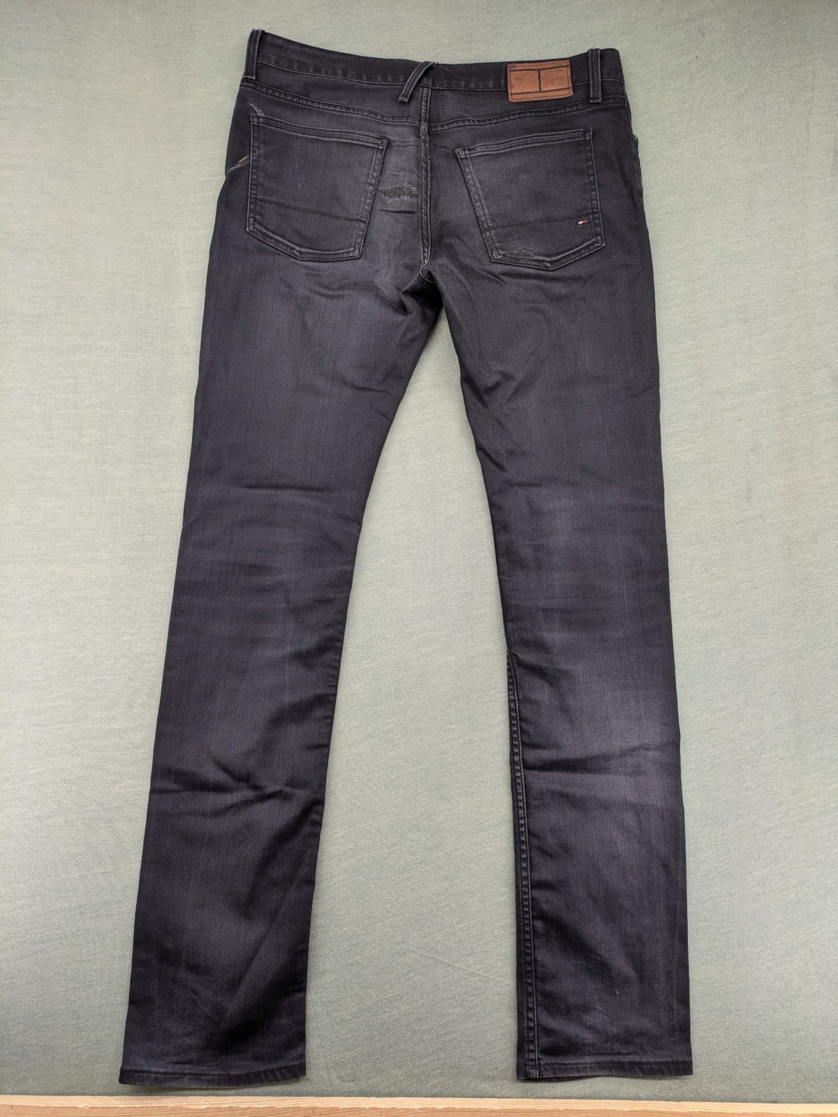 Tommy Hilfiger grey straight jeans faded denim with iconic logo detail.