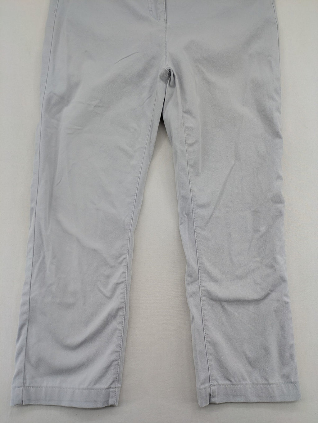 Chino grey capri pants five-pocket design with subtle embroidery and stretch cotton blend.