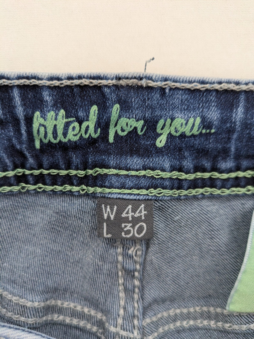 Multiblu blue straight jeans slim fit with decorative front zippers and light wash.