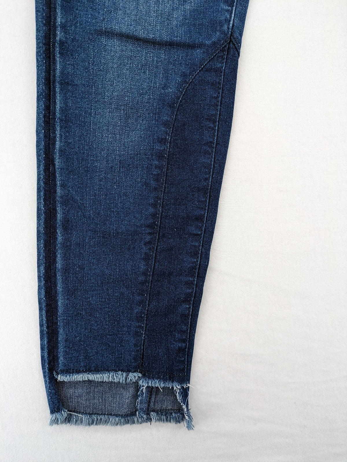 Best Connections blue skinny jeans with frayed hem and sporty side stripe.