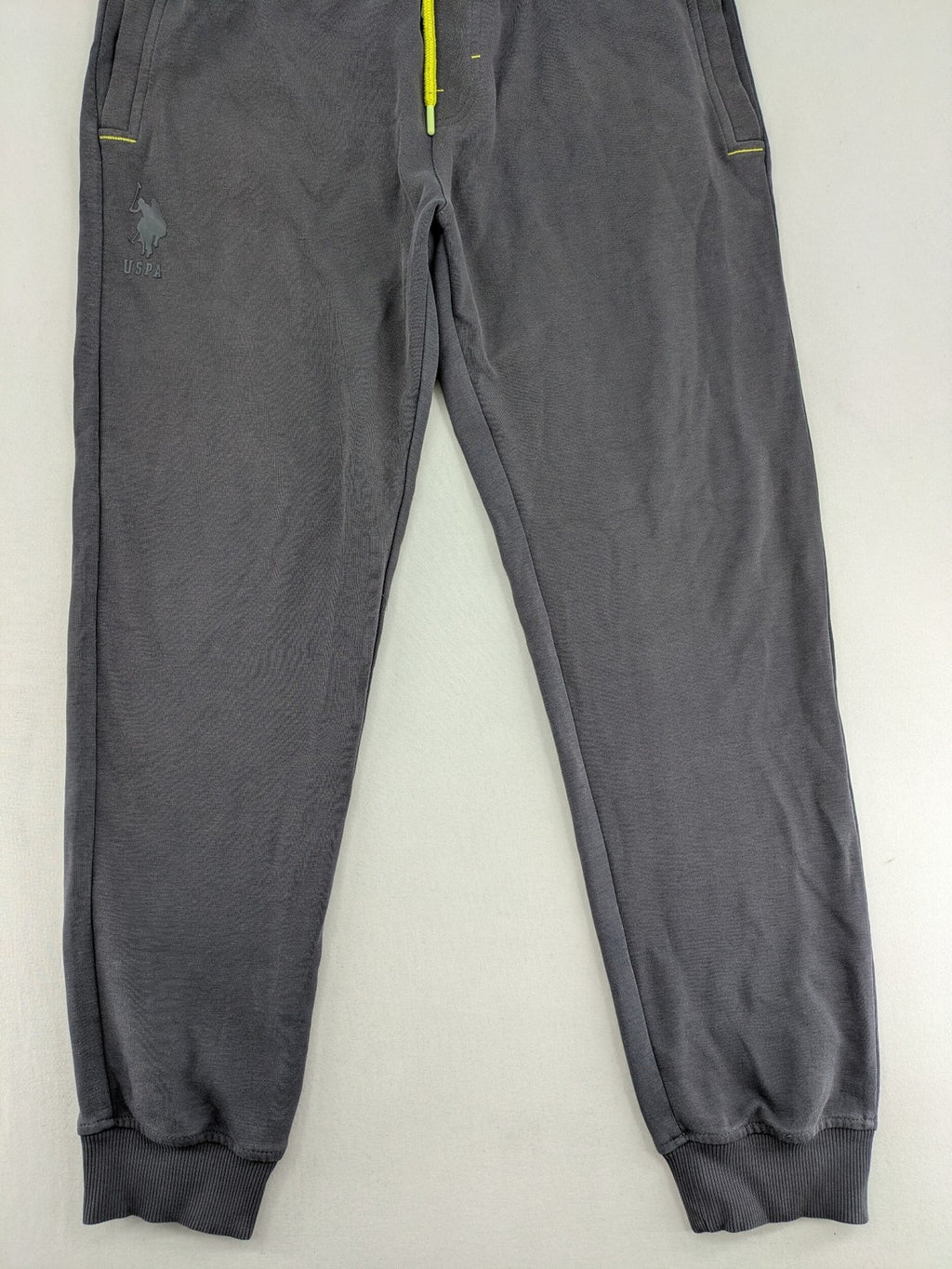 US Polo Assn grey sweatpants with light green drawstring and subtle logo detail.