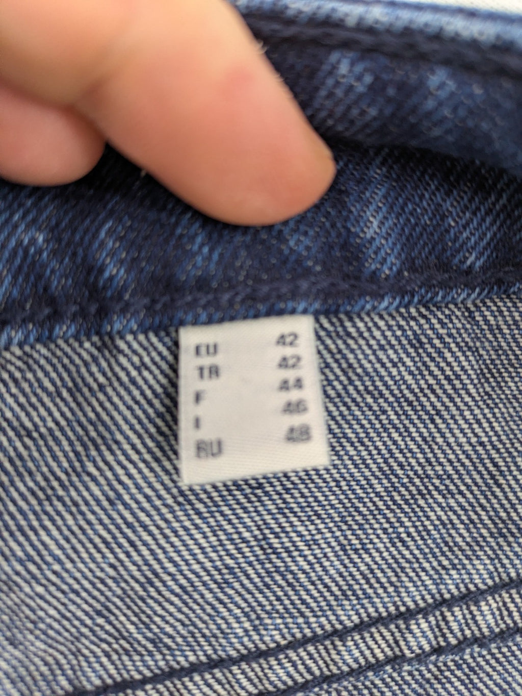 Tchibo blue straight jeans with five-pocket design and wide leg cut in durable cotton.