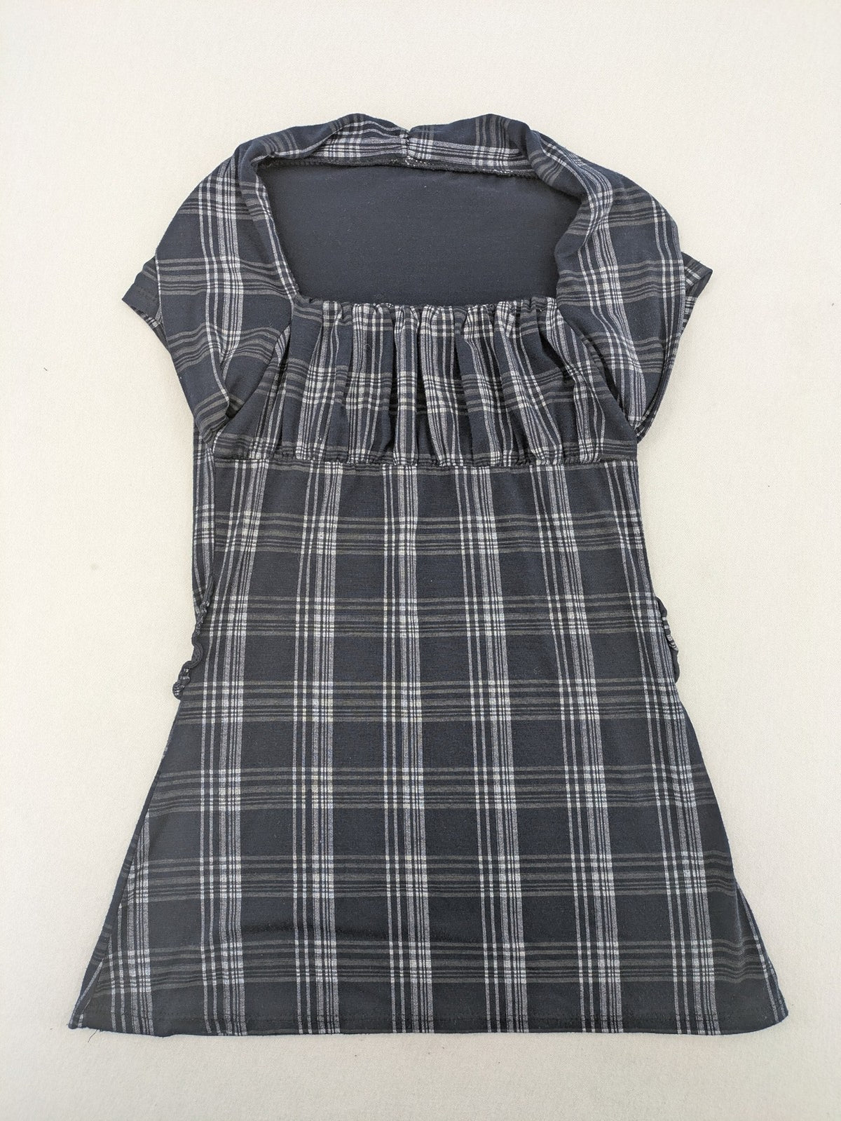 Eleganz navy and white checked top with square neckline and gathered bust detail.