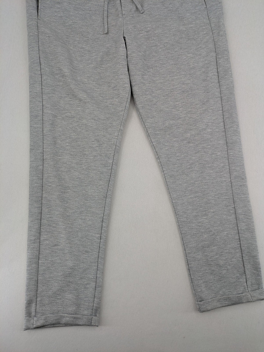 C&A grey sweatpants with elastic waistband, adjustable drawstring, and side pockets.