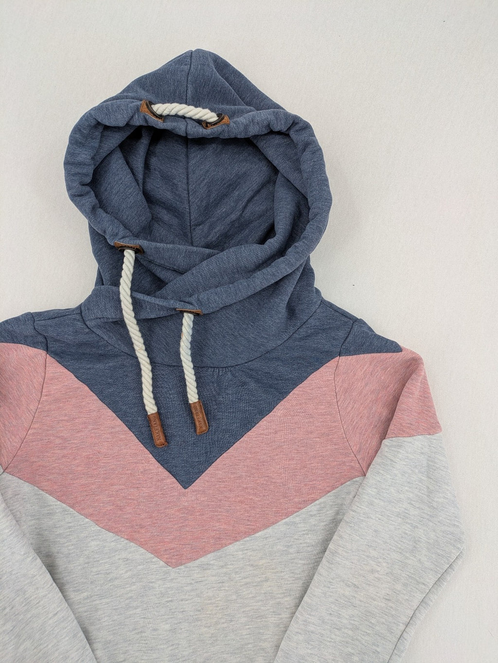 Naketano multi turtle neck jumper colorblock design in blue, pink, and grey.