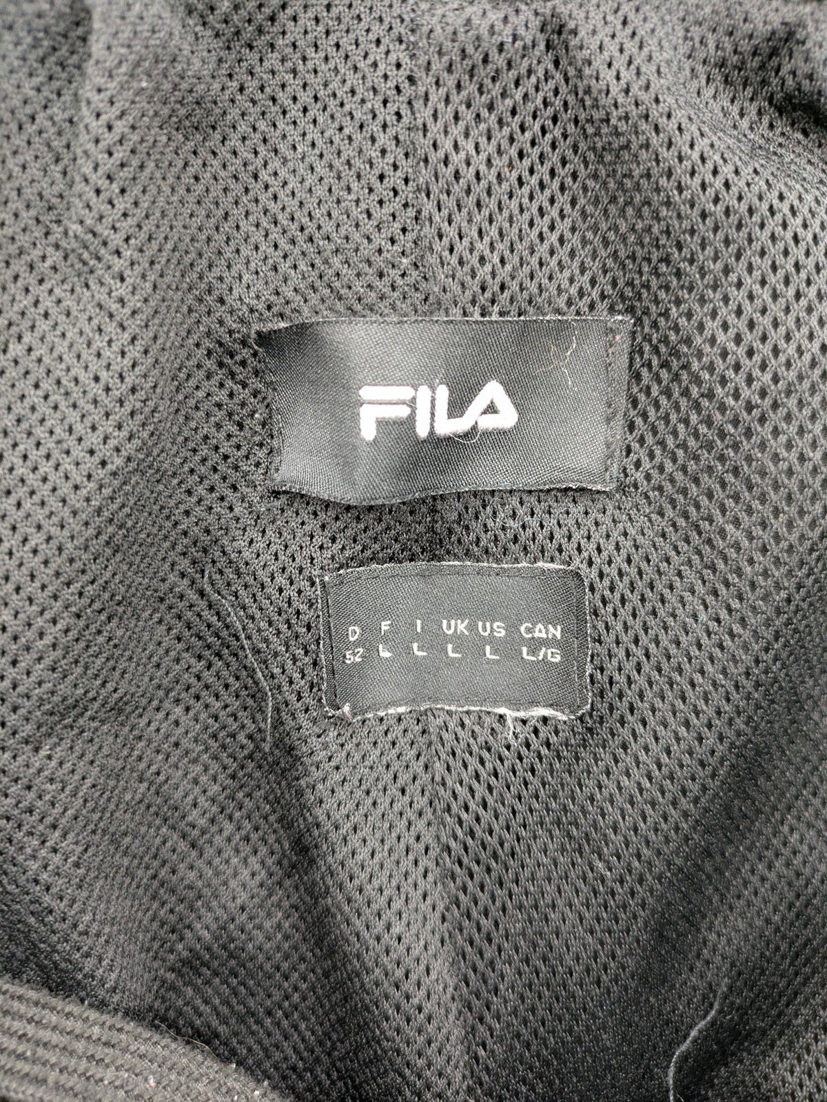 Fila grey jogging pants with red piping and embroidered logo on thigh.