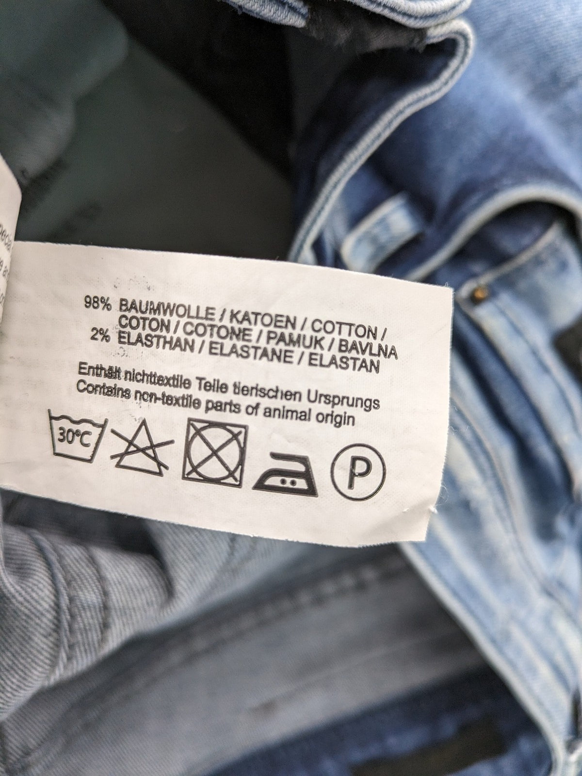 W32 blue straight jeans distressed details tapered fit button fly design