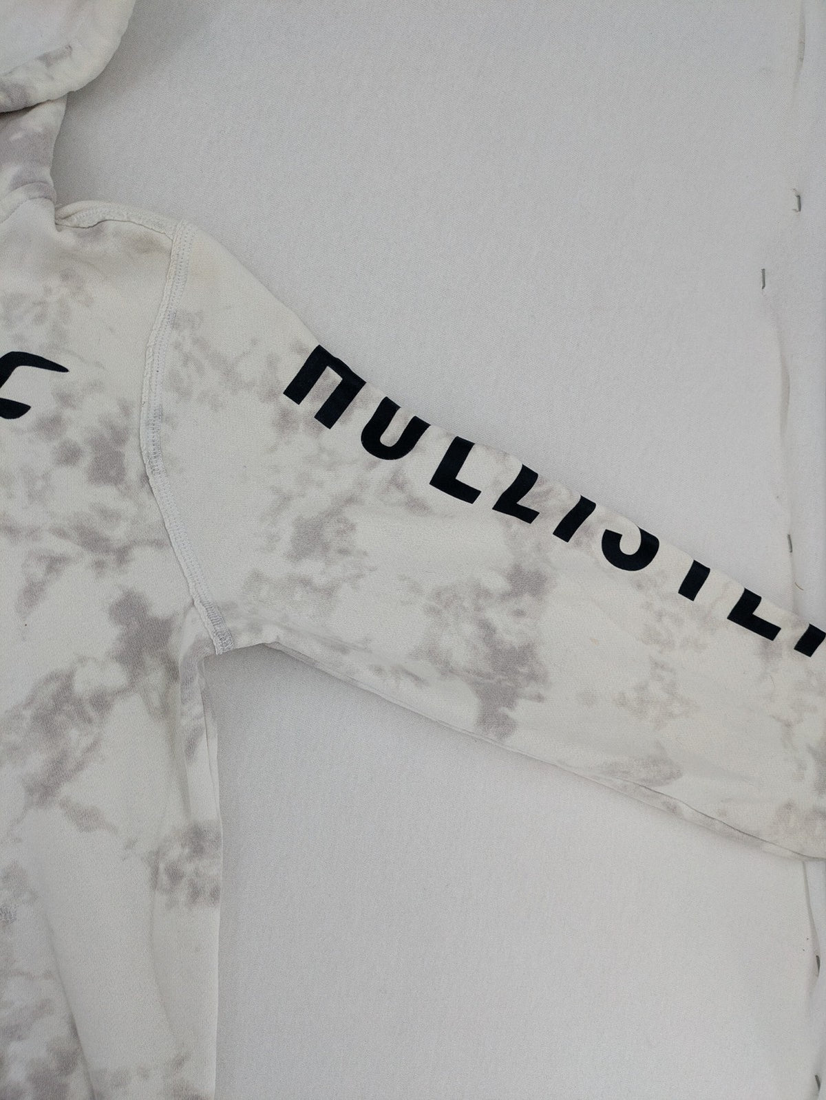 Hollister grey and white tie-dye hoodie with logo on chest, back, and sleeve.