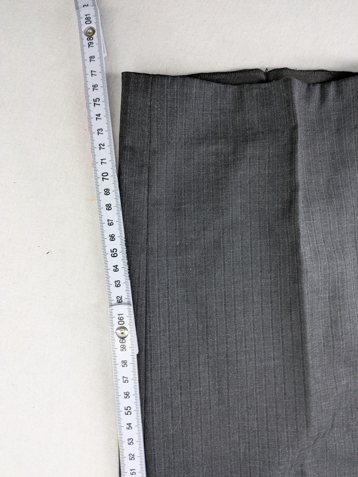 Desch grey suit pants with subtle pinstripe pattern and flat front design.