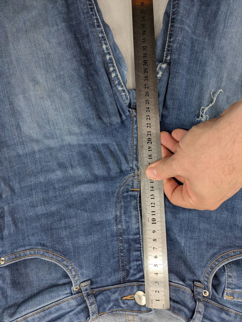 H&M blue skinny jeans with distressed details and comfortable stretch denim material.