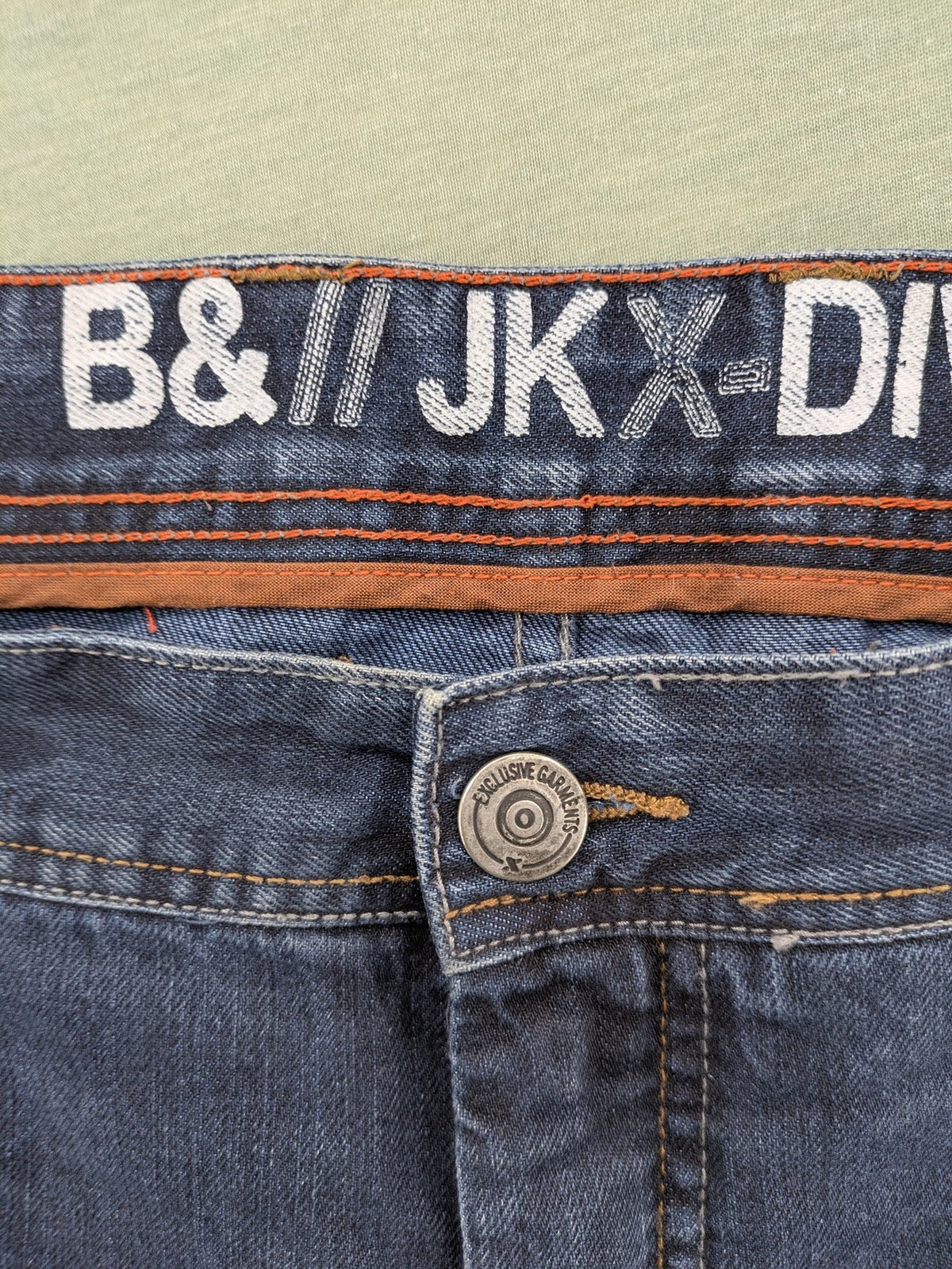 Canda blue straight jeans with five-pocket design and dark wash denim.