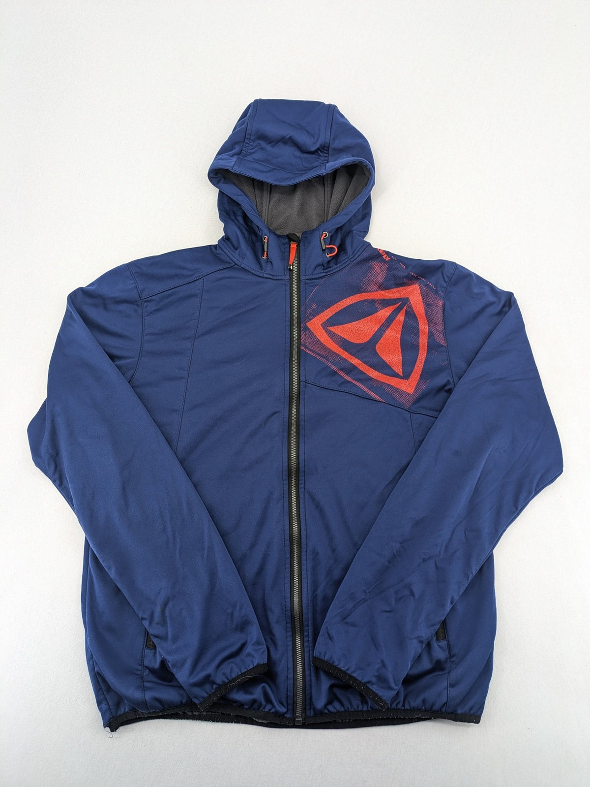Firefly blue softshell jacket with adjustable hood and prominent chest logo.
