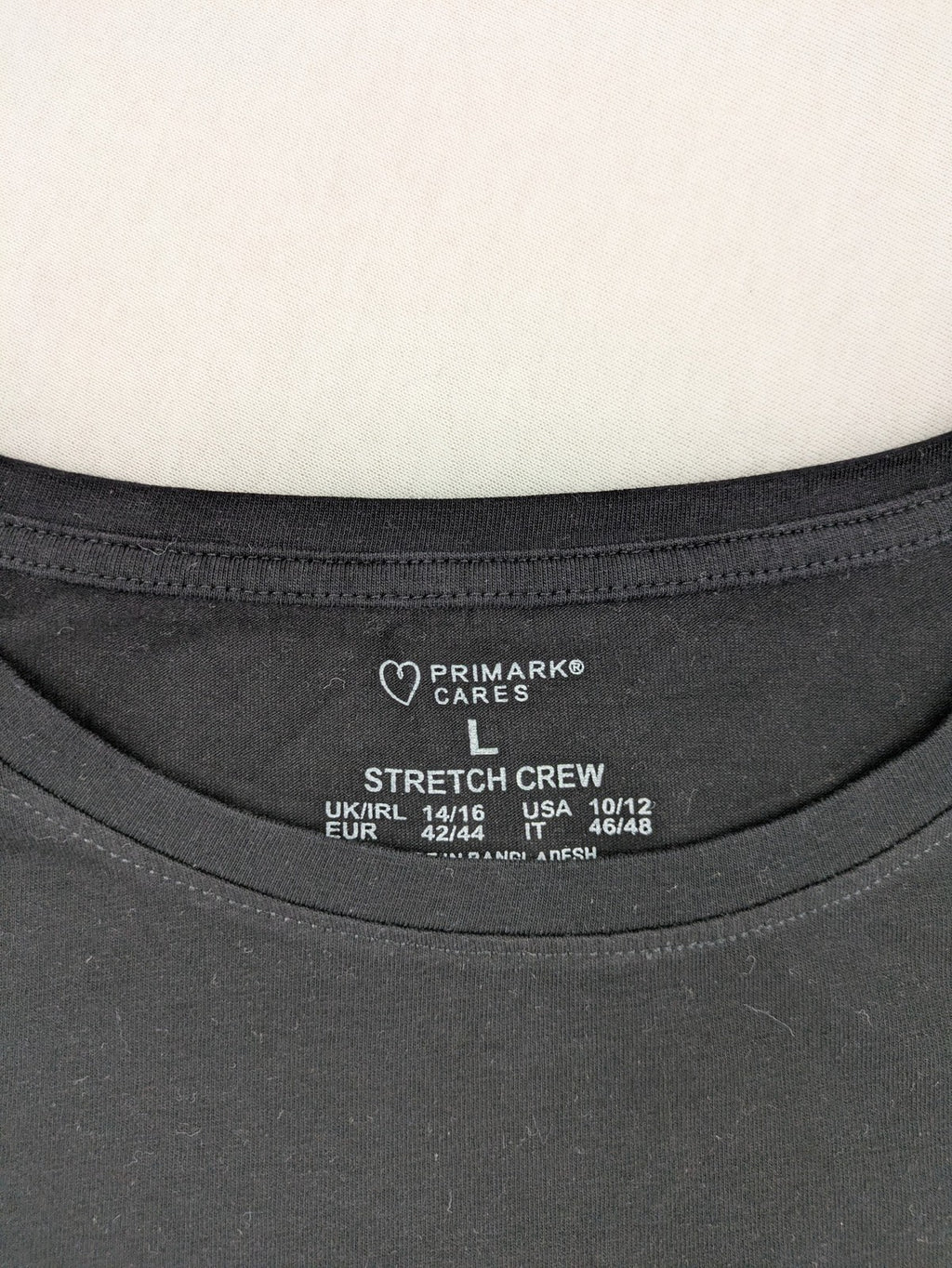Primark black graphic t-shirt featuring yellow and white Pornhub logo on chest.
