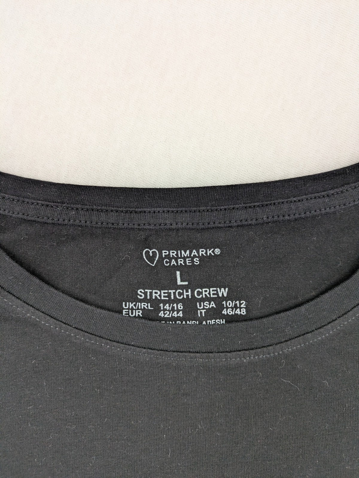 Primark black graphic t-shirt featuring yellow and white Pornhub logo on chest.
