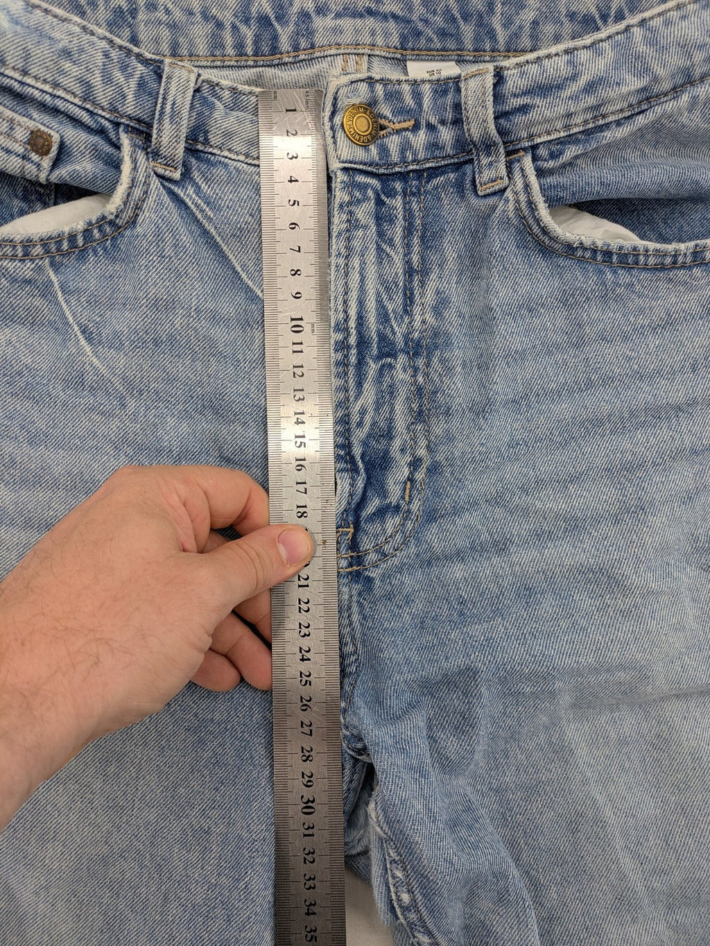 H&M blue wide leg jeans with distressed details and high waist, 100% cotton.