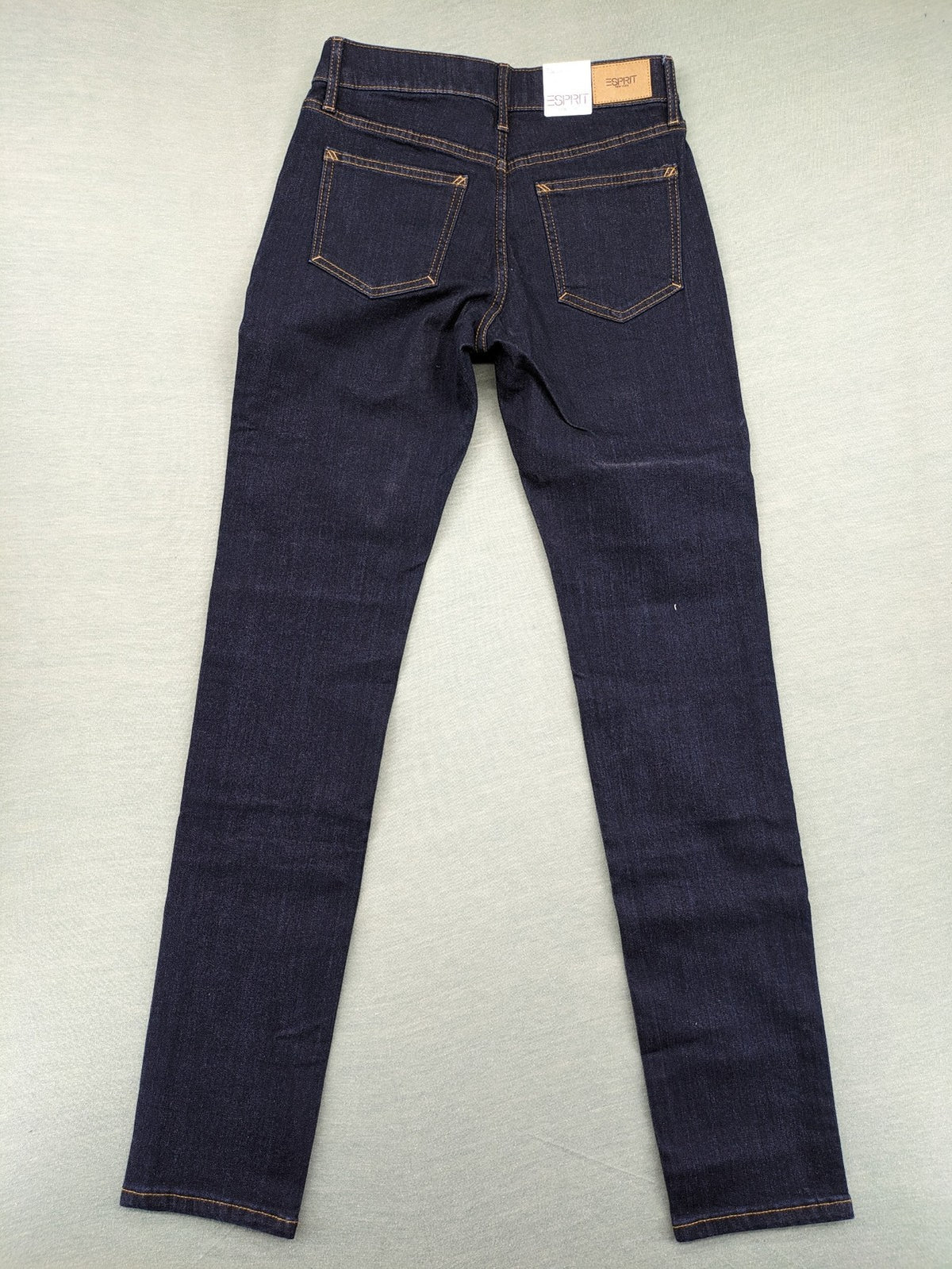 Esprit navy straight jeans with five-pocket style and yellow contrast stitching.
