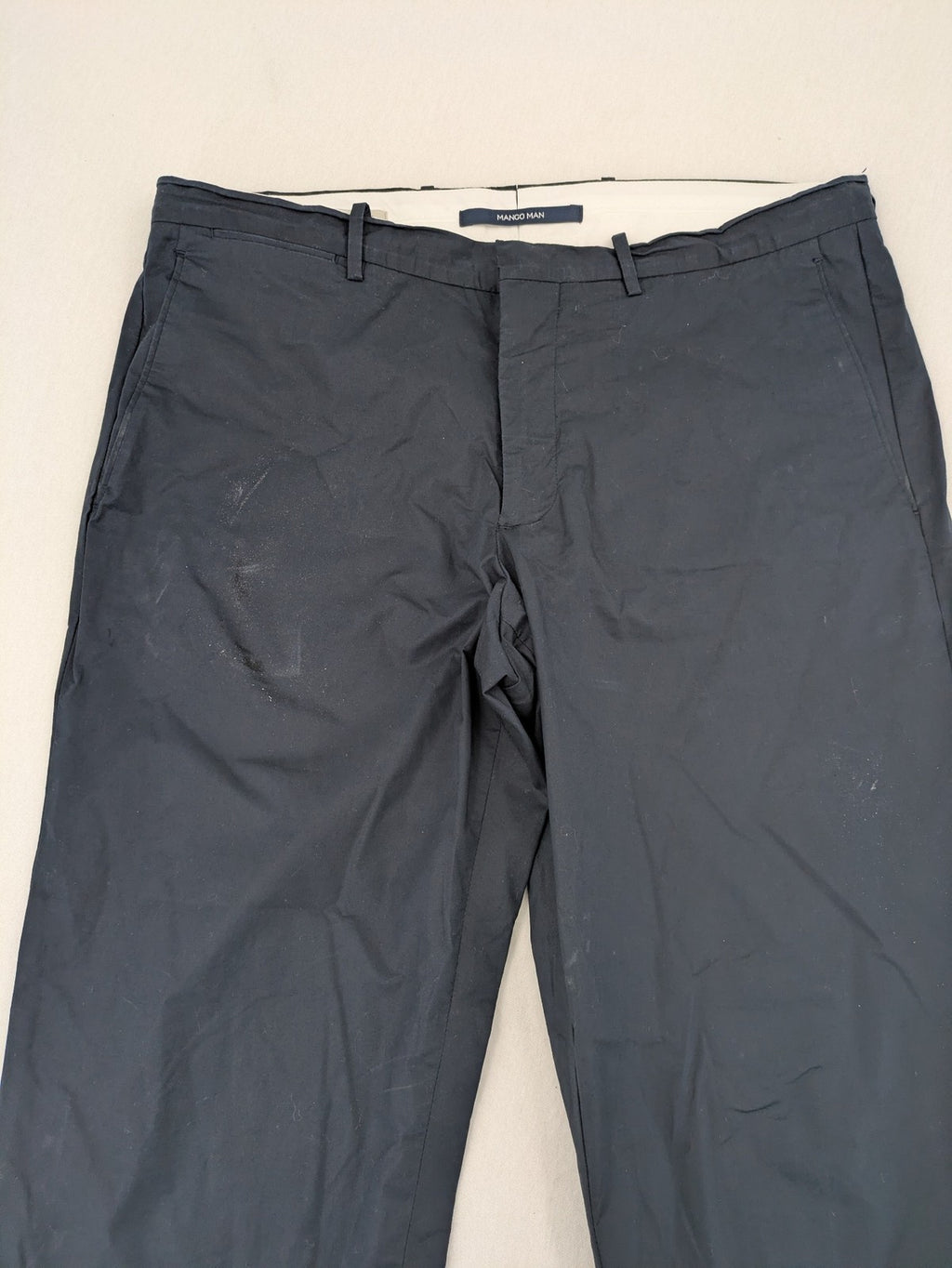 Mango Man black chinos flat front design with zipper and button closure.