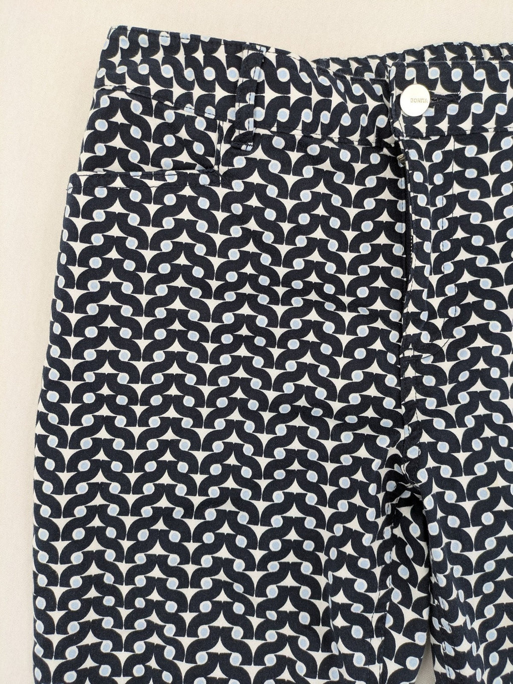 Bonita navy pants with geometric pattern, stretch material, and classic zip fly closure.