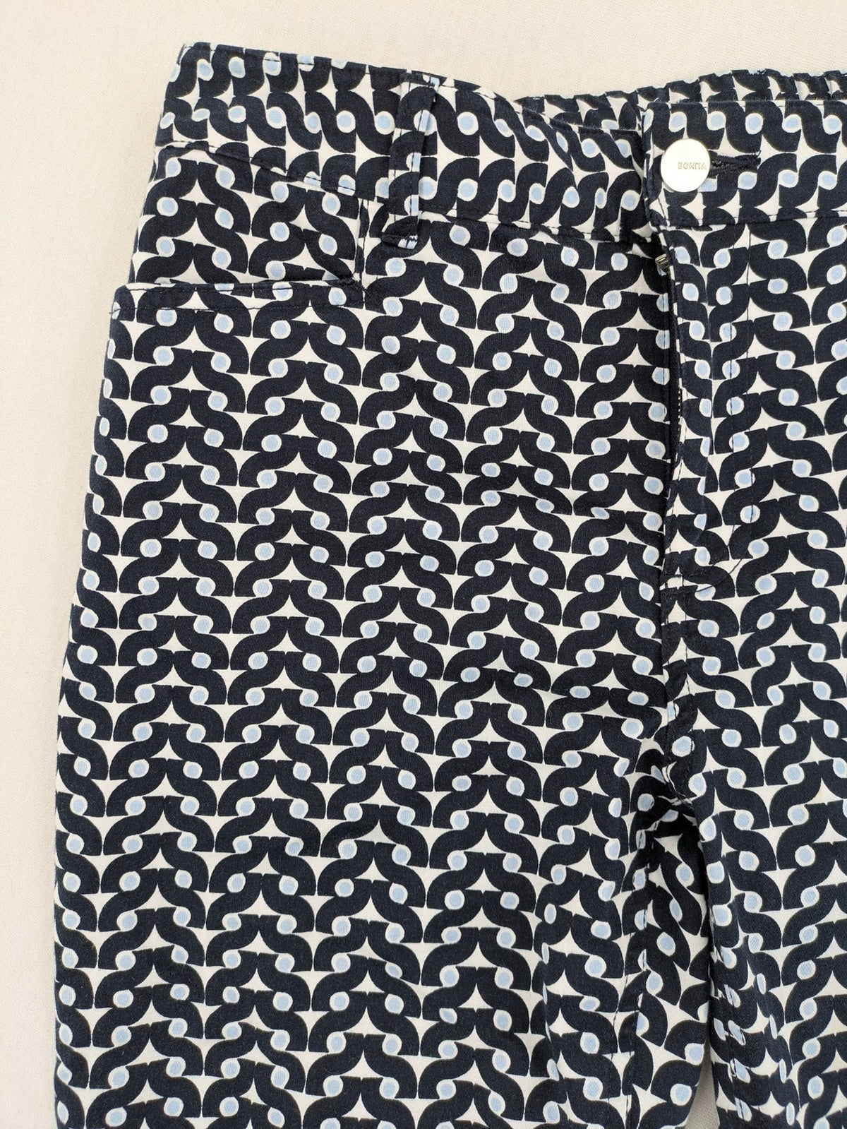 Bonita navy pants with geometric pattern, stretch material, and classic zip fly closure.