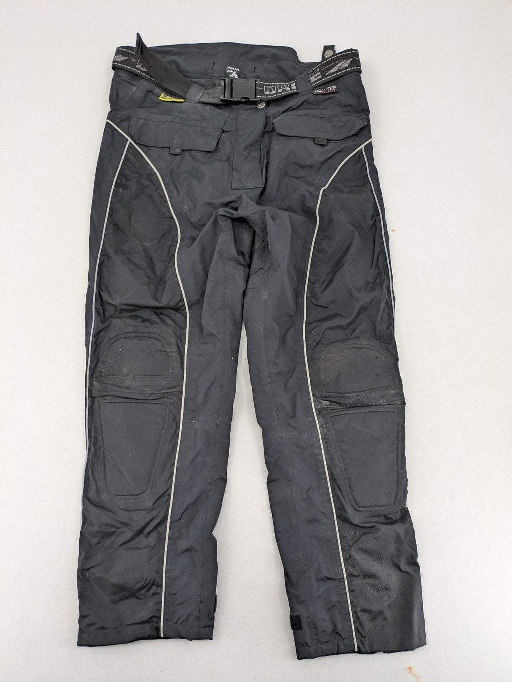 Polo black chaps with grey and white accents, featuring protective knee pads and adjustable belt.