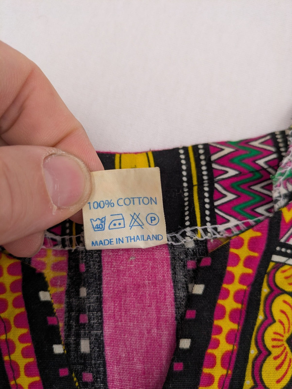 M/L multi Dashiki shirt with vibrant ethnic print on light blue cotton fabric.