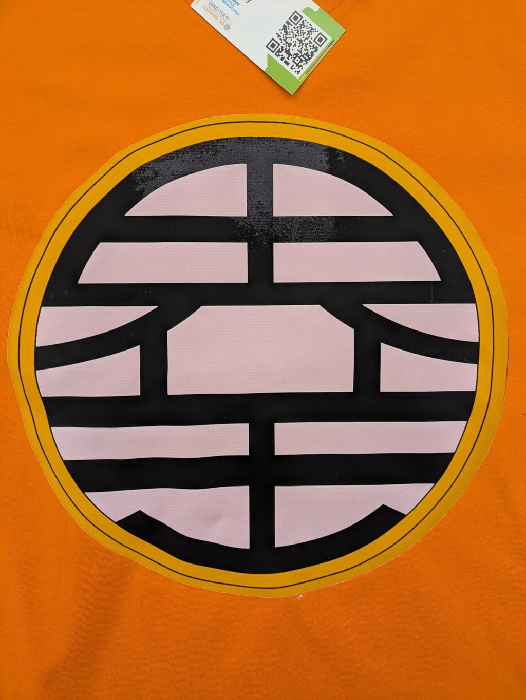 Dragon Ball Z orange t-shirt featuring 'Go' kanji symbol, made of soft cotton.