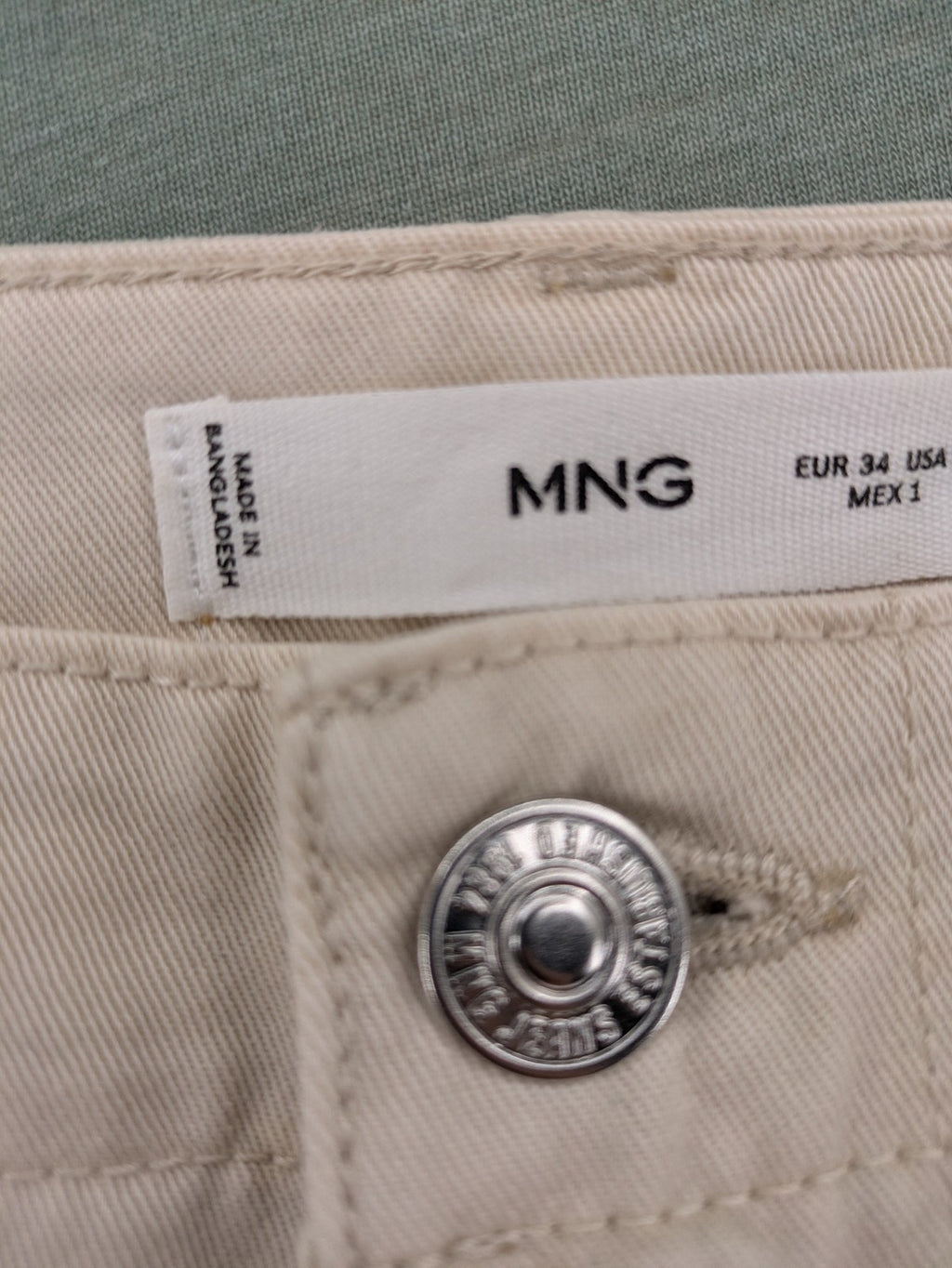 MNG beige cargo pants with straight leg, button closure, and patch pockets.