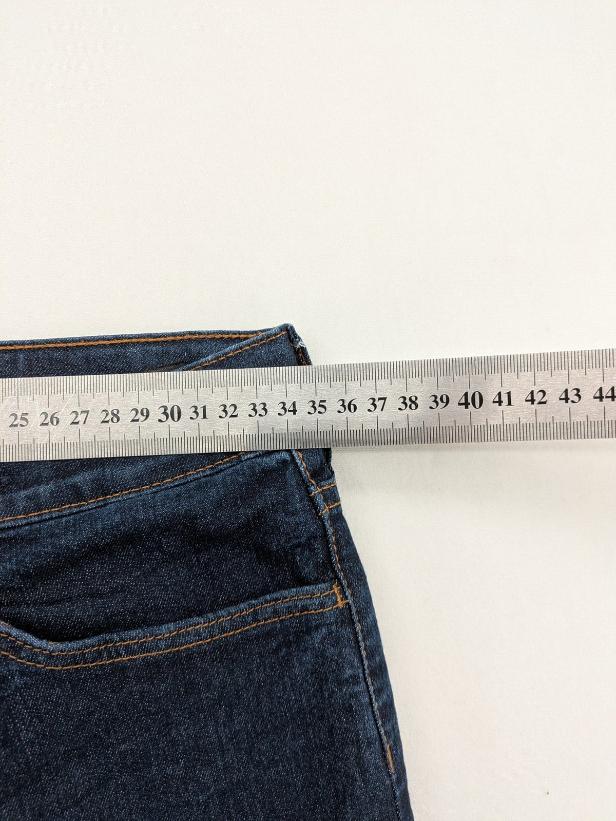 H&M blue skinny fit jeans with classic 5-pocket style and button closure.
