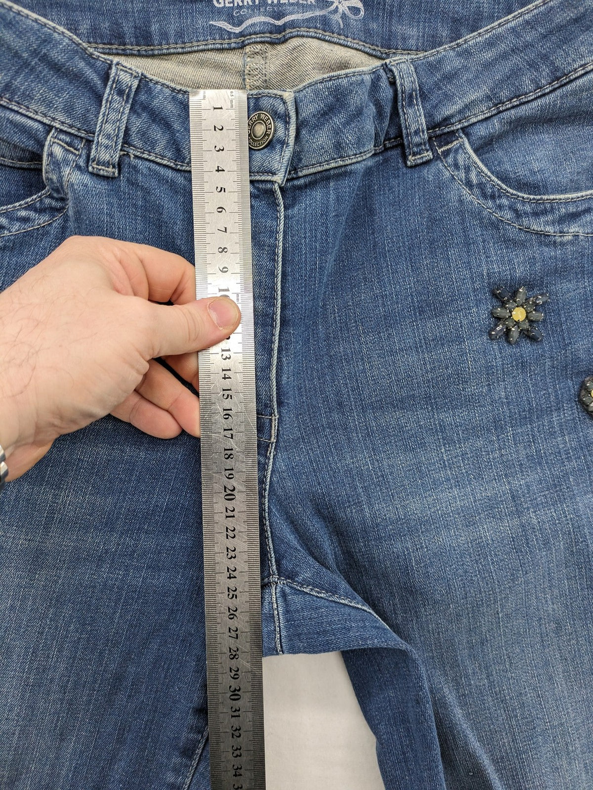 Gerry Weber blue straight jeans with decorative rhinestone appliqués and stretch denim material.