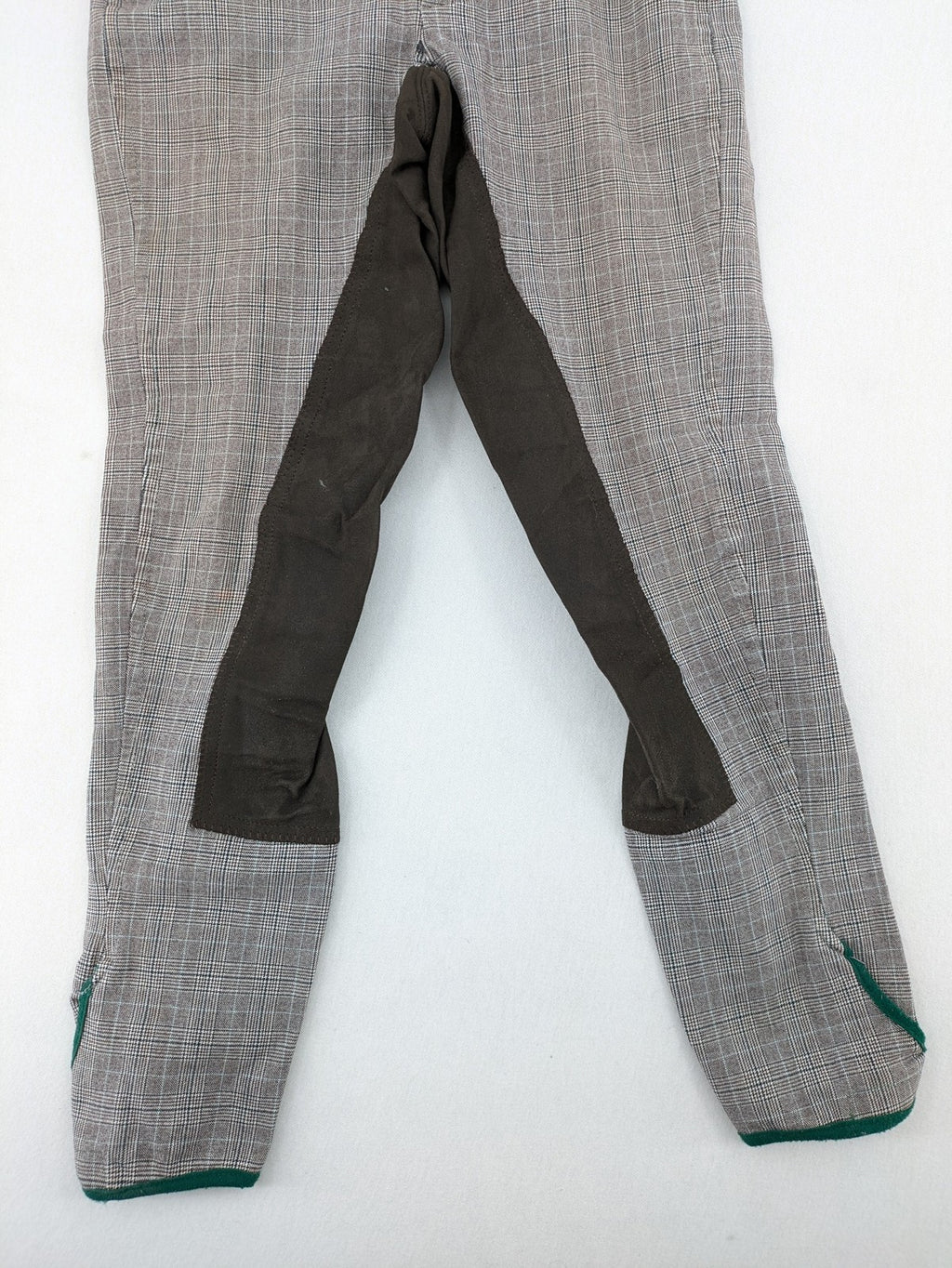 Cavallo grey check riding pants with brown full-seat patch and logo detail.