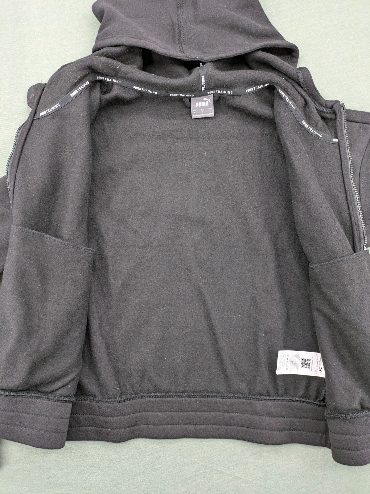 Puma grey zip-through hoodie with iconic logo and two practical pockets.