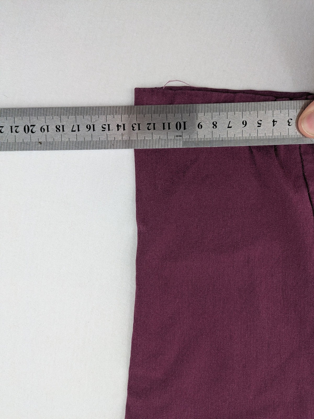 Pink Cherry pants pink stretchy fabric with decorative buttons and elastic waistband.