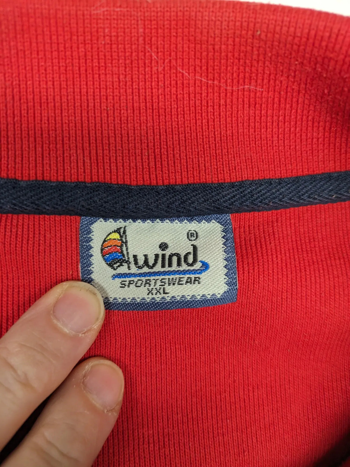 Wind Sportswear red turtle neck jumper with classic polo collar and zigzag stitching.