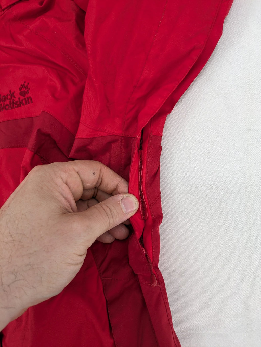 Jack Wolfskin red outdoor jacket with adjustable hood and Texapore waterproof technology