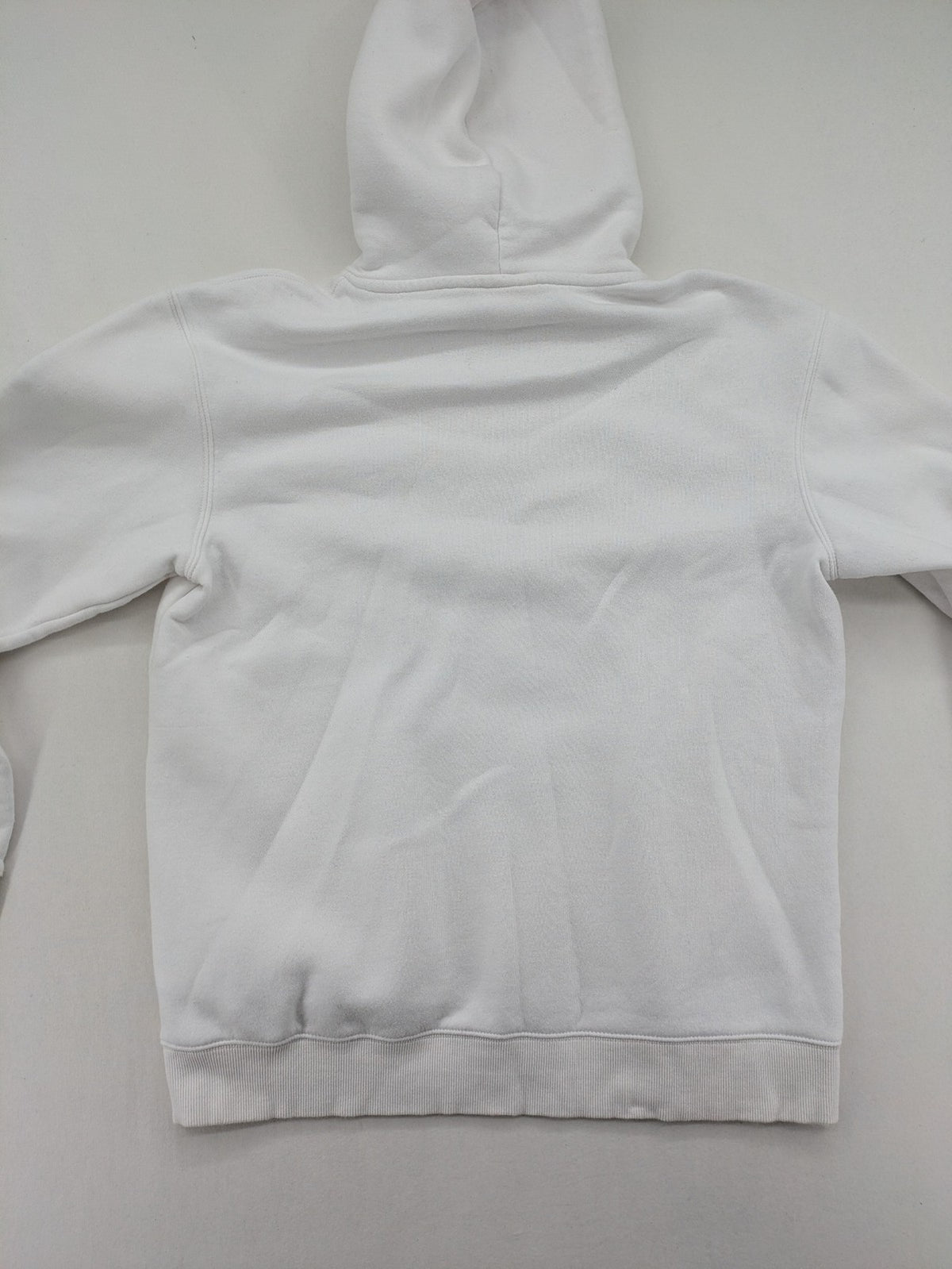 New York white hoodie with raised blue and red "GIANTS" logo and adjustable hood.