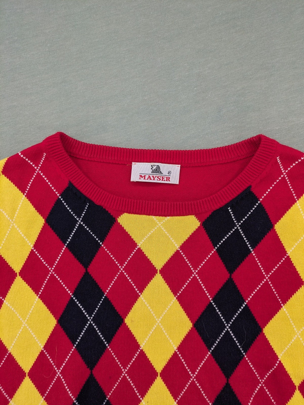 MAYSER multi turtle neck jumper argyle pattern in red, yellow, and black cotton.