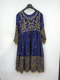 Bollywood bridal party dress gold with intricate blue embroidery and flowing Anarkali silhouette.