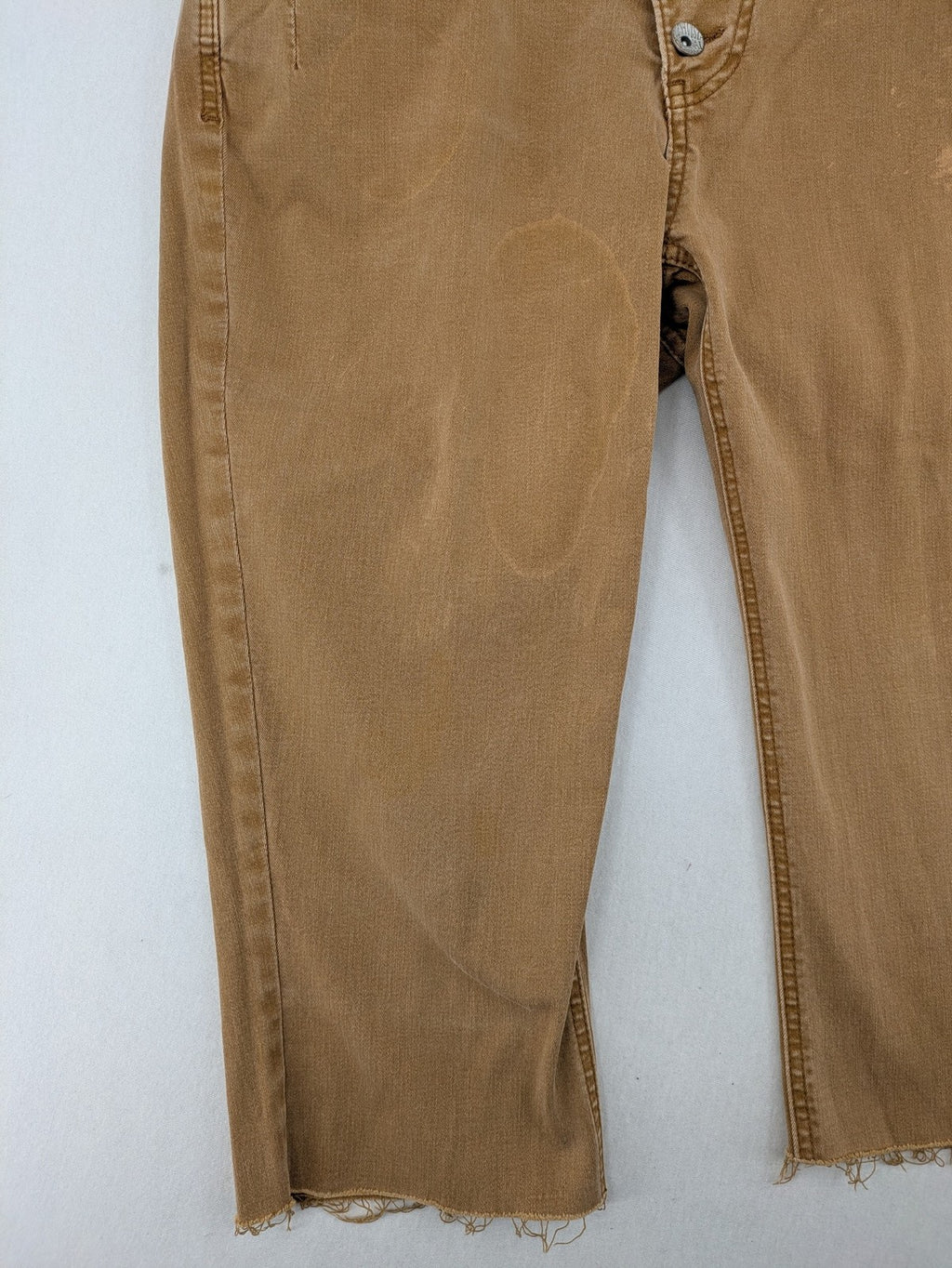 Buena Vista beige capri jeans with frayed hem and button fly detail.